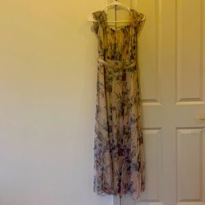 The color creamy pink with sparkles and flowers .